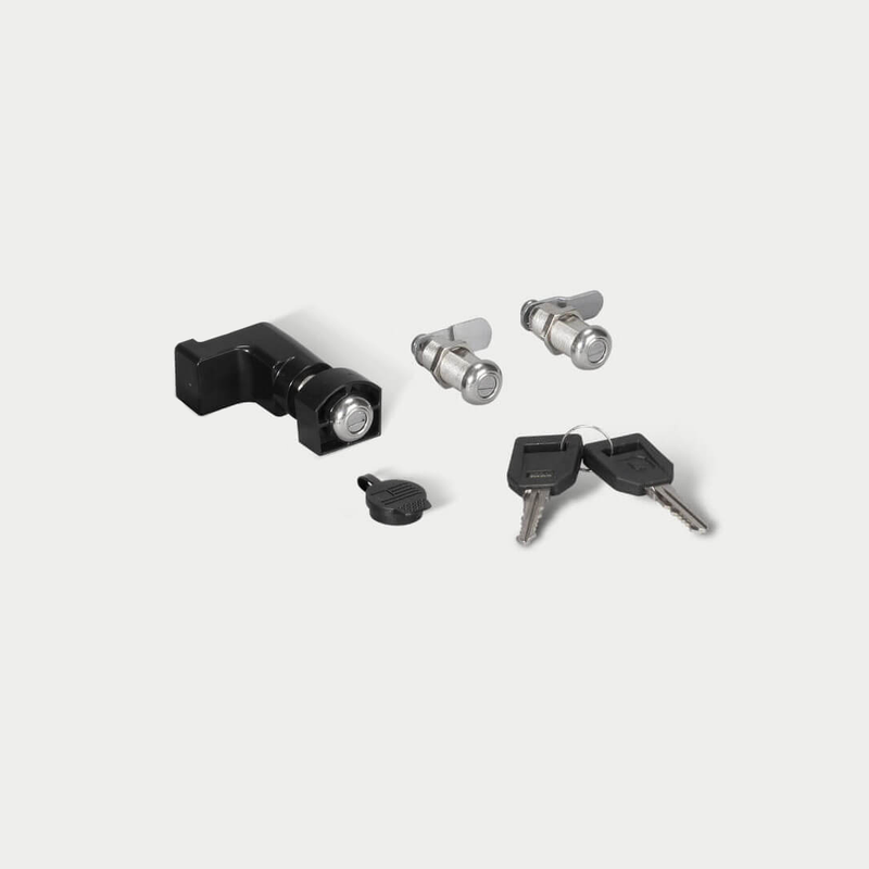 DECKED lock 3-pack shown in studio: one black drawer lock, two silver stash bin cam locks, one cap and two matching keys