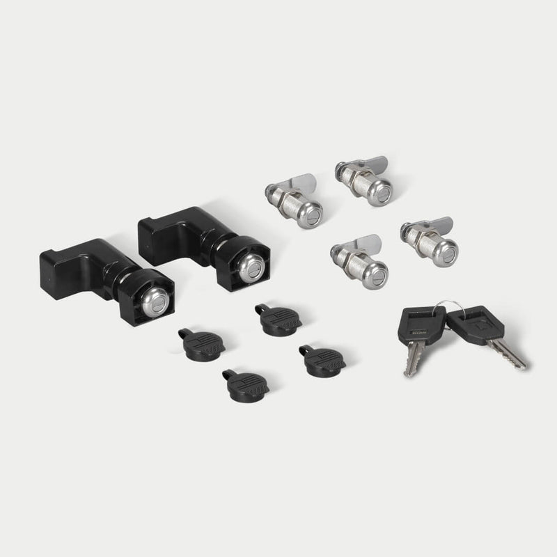 DECKED lock 6-pack shown in studio: two black drawer locks, four silver stash bin cam locks, four caps and two matching keys