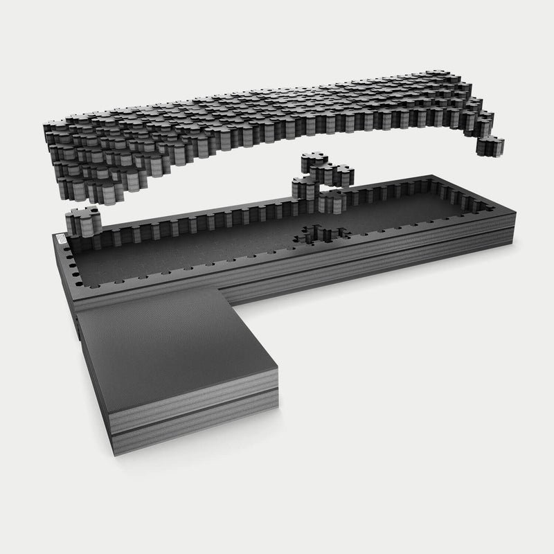 Exploded studio render of the full-size standard DECKED Piecekeeper PuzzleFoam showing three stacked foam layers, the pluck-grid top sheet and the L-shaped side brace