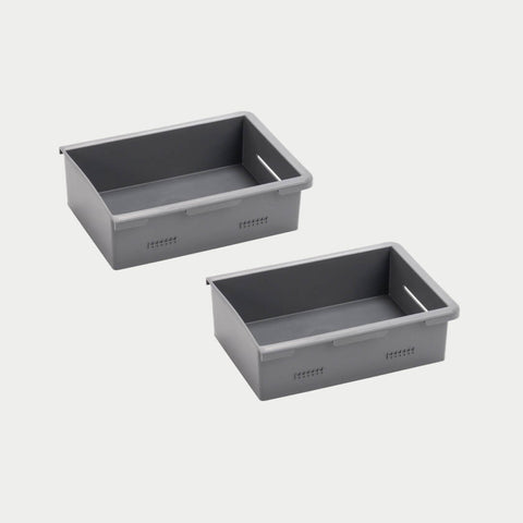 Pair of shallow gray DECKED Stash Bins shown in studio, low open-top bins with molded lip flanges