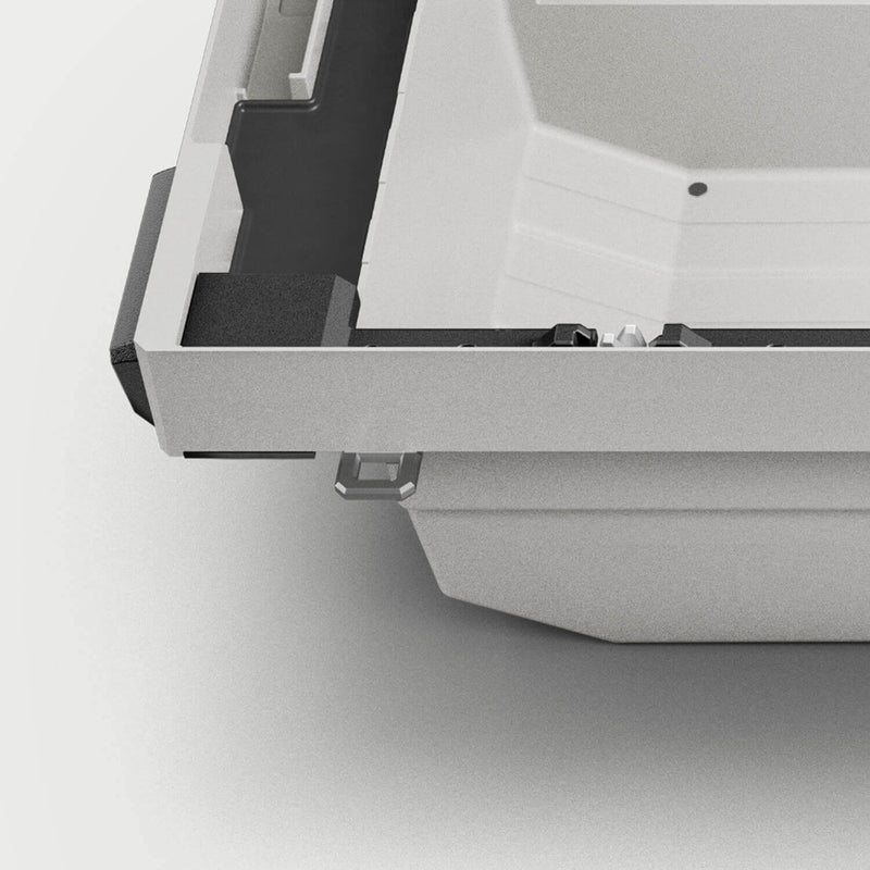 Studio render of a DECKED Tool Box corner showing the mounting position where the aluminum D-ring tie down anchor fits under the lip
