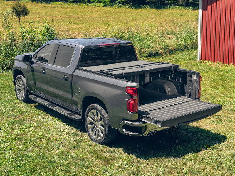 Hard tonneau cover folded two-thirds toward the cab with the tailgate down