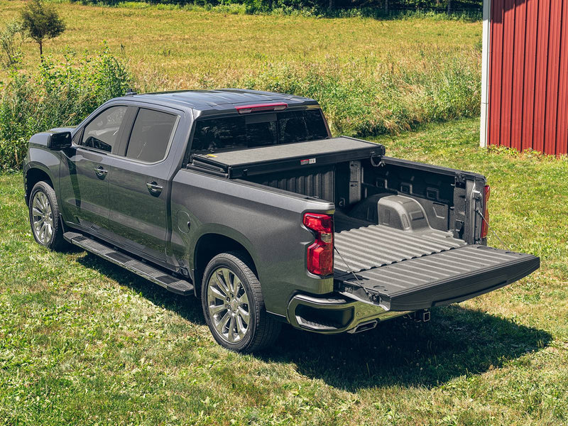 Hard tonneau cover fully folded at the cab, leaving the bed open