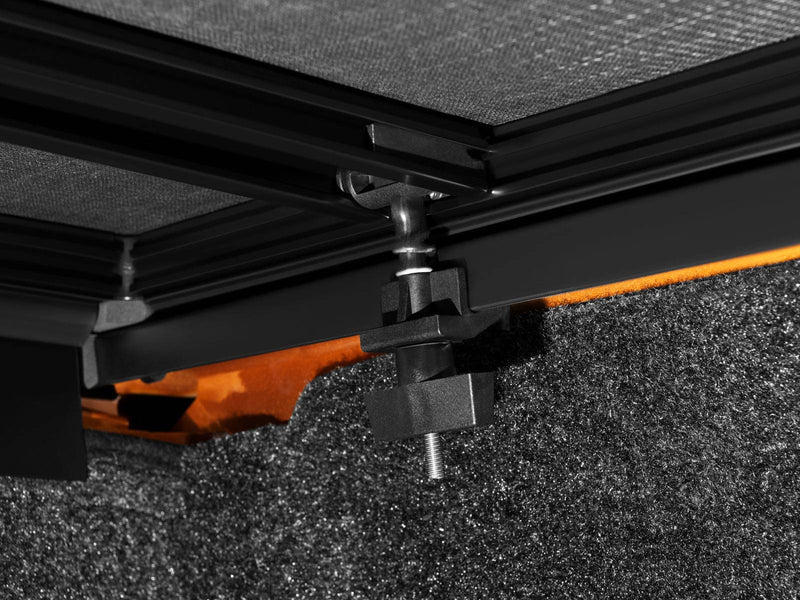Rail clamp tightened under the bed rail with its knob and threaded rod