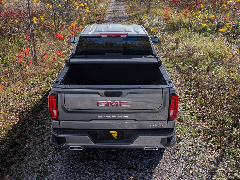Overhead rear view of a pickup with the soft cover folded up against the cab