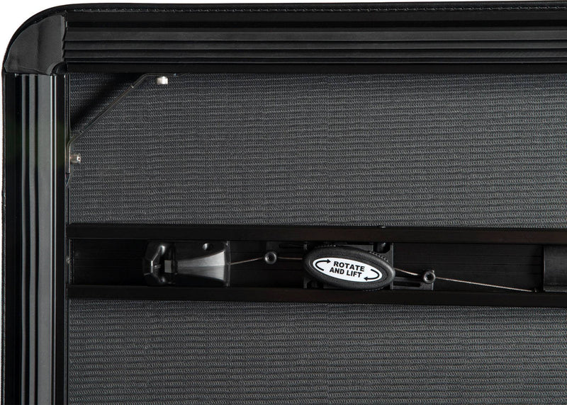 Rotate-and-lift latch handle and cable on the cover underside
