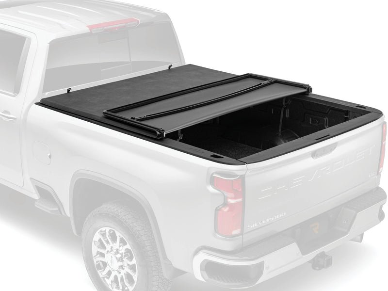 Soft tri-fold tonneau cover partly folded, studio render with the truck faded out