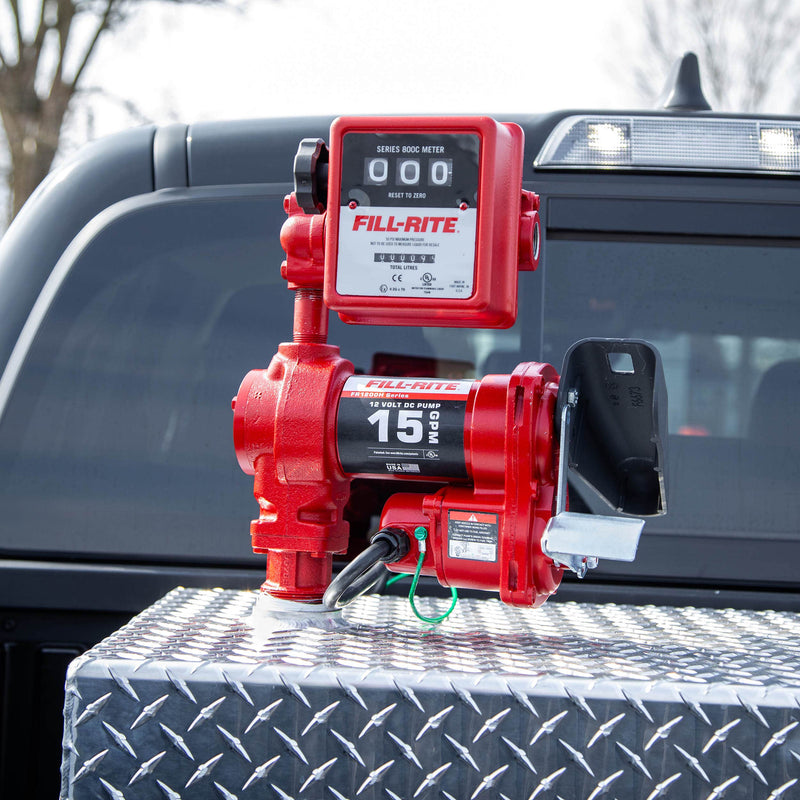 Fill-Rite FR1211HLN 15 GPM, 12V DC Pump, 5' Ground Wire, 18'12 Gauge 2 Wire Battery Cable, mounted on a diamond-plate transfer tank in a pickup bed