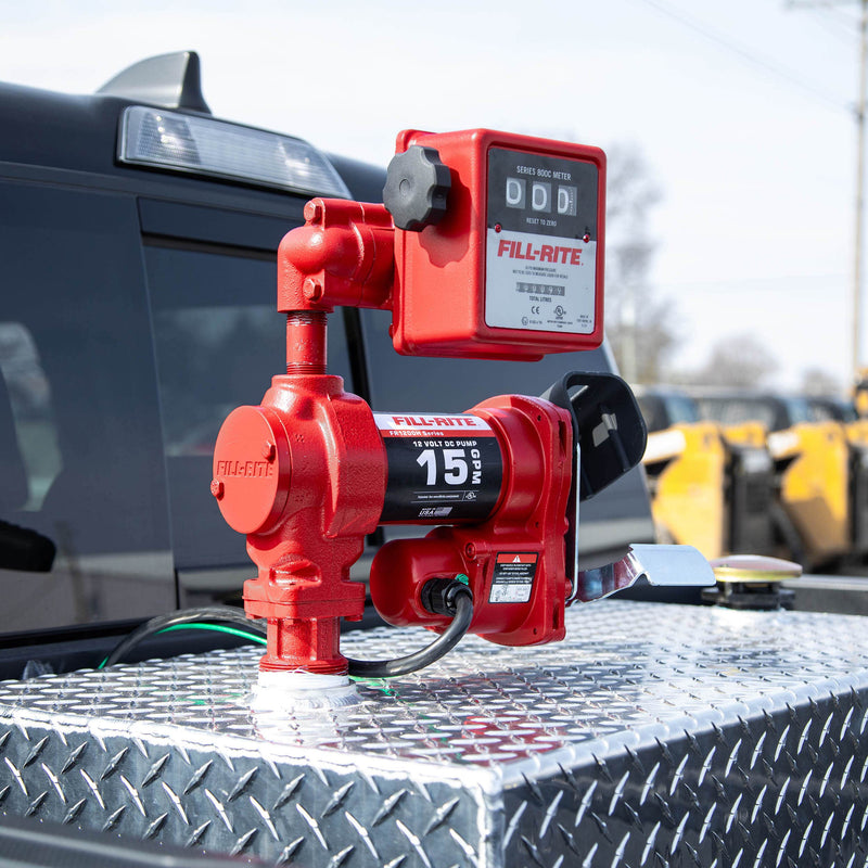 Fill-Rite FR1211HLN 15 GPM, 12V DC Pump, 5' Ground Wire, 18'12 Gauge 2 Wire Battery Cable, mounted on a diamond-plate transfer tank in a pickup bed