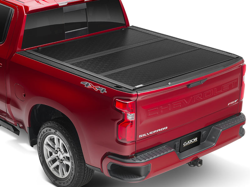 Gator EFX hard folding tonneau cover: A red full-size pickup with a closed black hard folding cover
