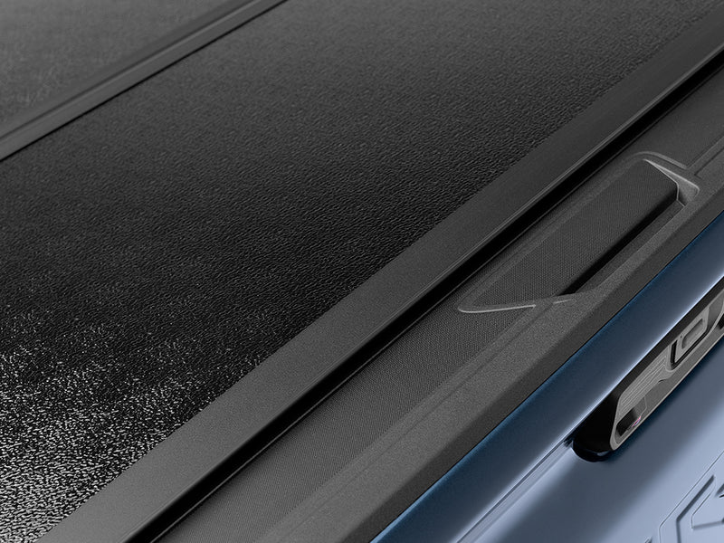 Gator EFX hard folding tonneau cover: Close-up of the edge of a closed hard cover panel along the bed rail