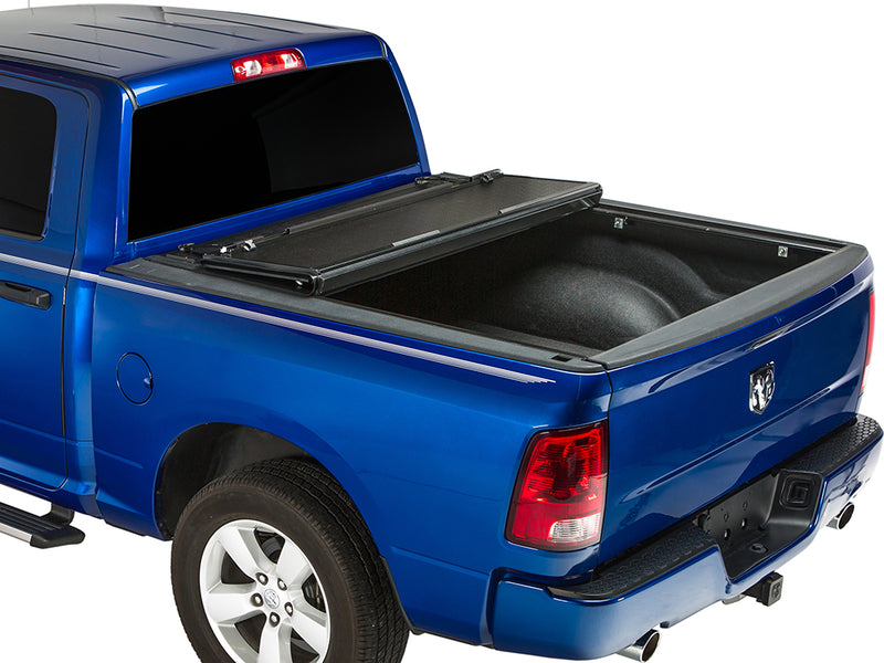 Gator FX hard folding tonneau cover: rear panel folded forward on a blue Ram pickup