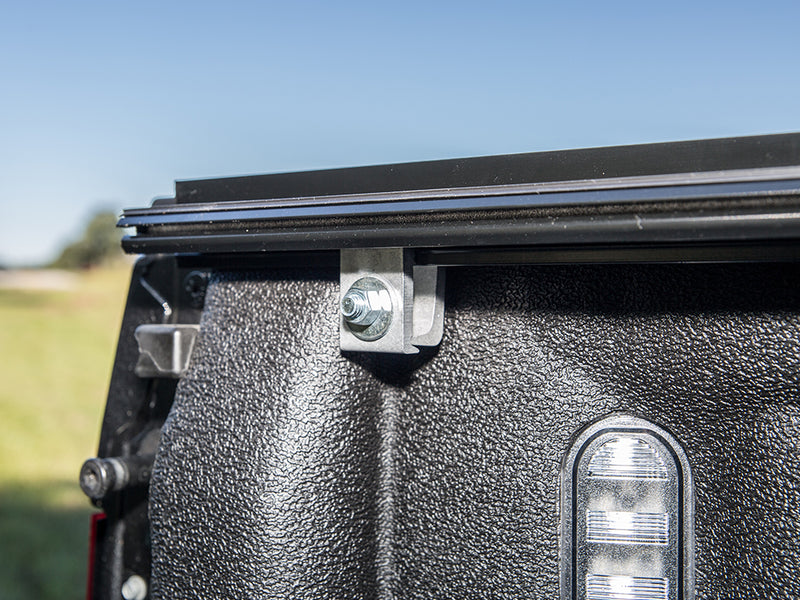 Gator FX hard folding tonneau cover: clamp under the bed rail and the folded cover, inside the bed