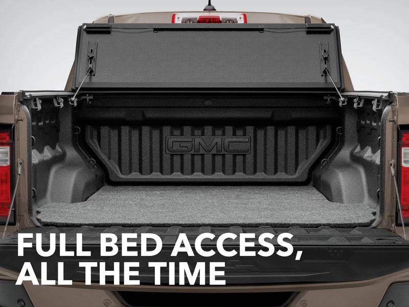 Gator FX tonneau cover (upright) on a GMC Sierra bed: hard folding cover stood upright against the cab of a GMC bed with a liner, captioned Full Bed Access, All the Time