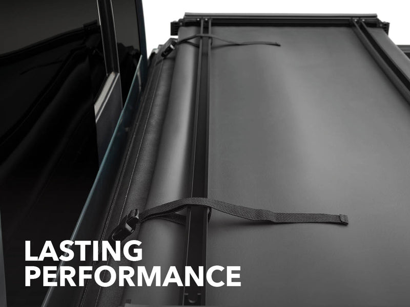 Close-up of the Gator SFX tonneau cover: A folded soft cover section and strap against the cab with a Lasting Performance caption