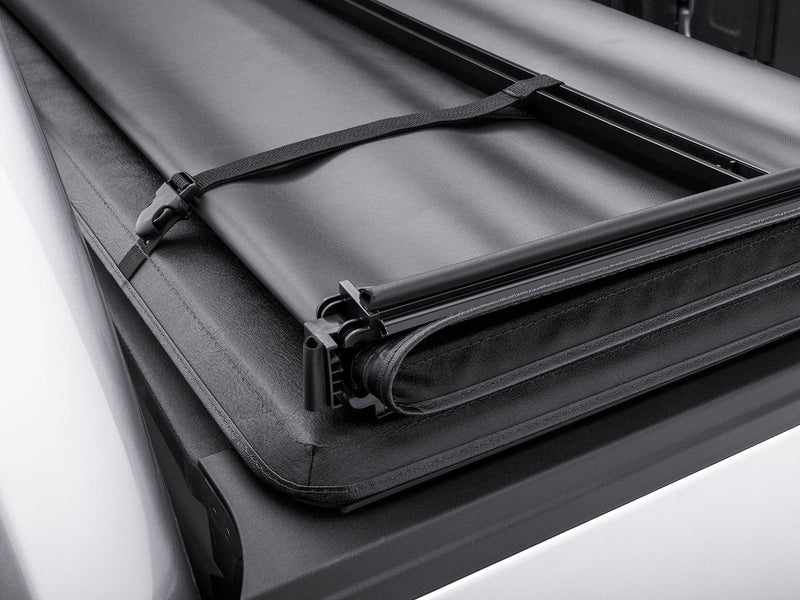 Gator SFX soft tri-fold tonneau cover: folded sections held together by the storage strap, close-up