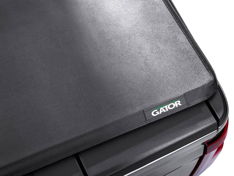 Gator SFX soft tri-fold tonneau cover: closed cover's rear corner with the Gator badge, close-up