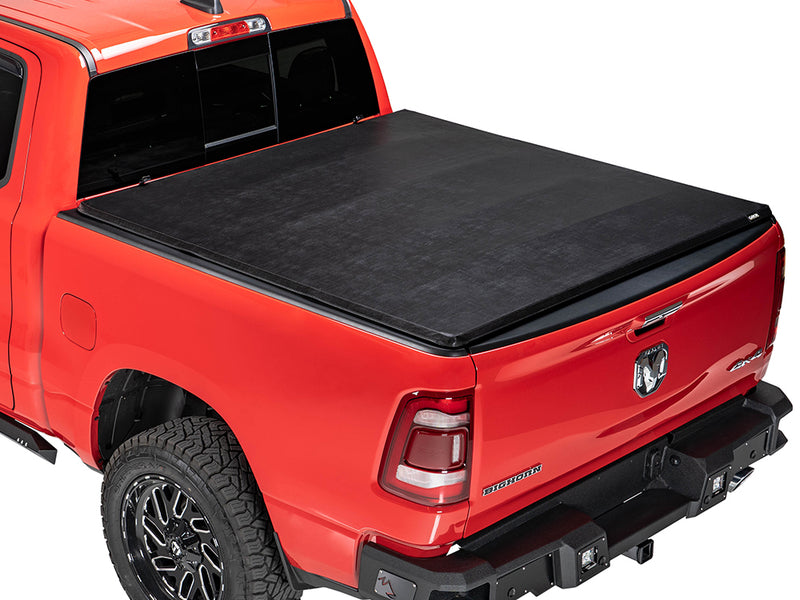 Gator SFX soft tri-fold tonneau cover: closed on a red Ram pickup, rear three-quarter view