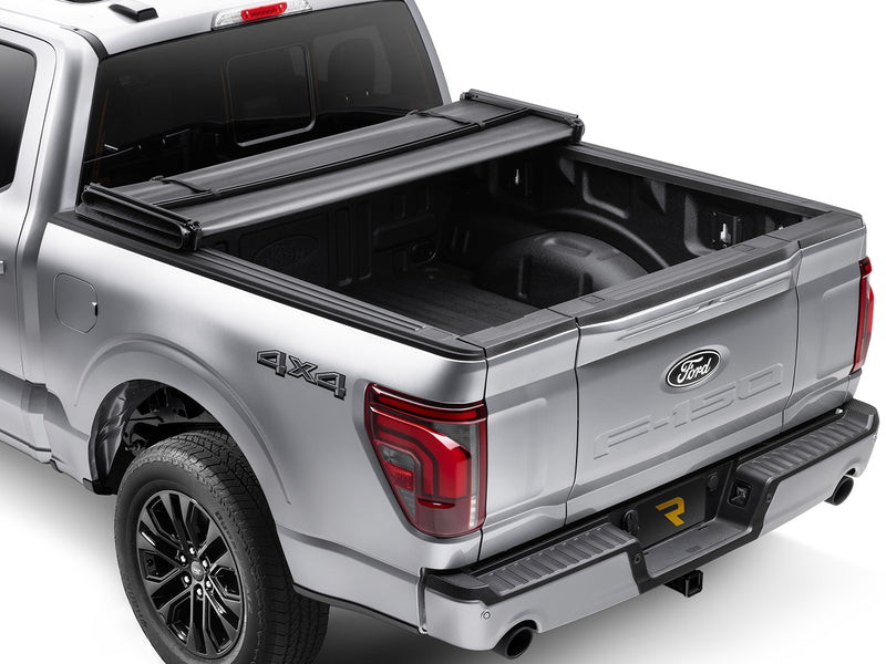 Gator SFX soft tri-fold tonneau cover: folded fully forward on a silver Ford pickup