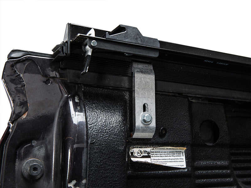 Gator SRX soft roll-up tonneau cover: Close-up of a soft roll-up tonneau rail clamp mounted inside the bed wall near the tailgate