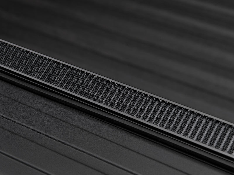 Gator SRX soft roll-up tonneau cover: Close-up of a tonneau side rail with its textured seal strip along the bed wall