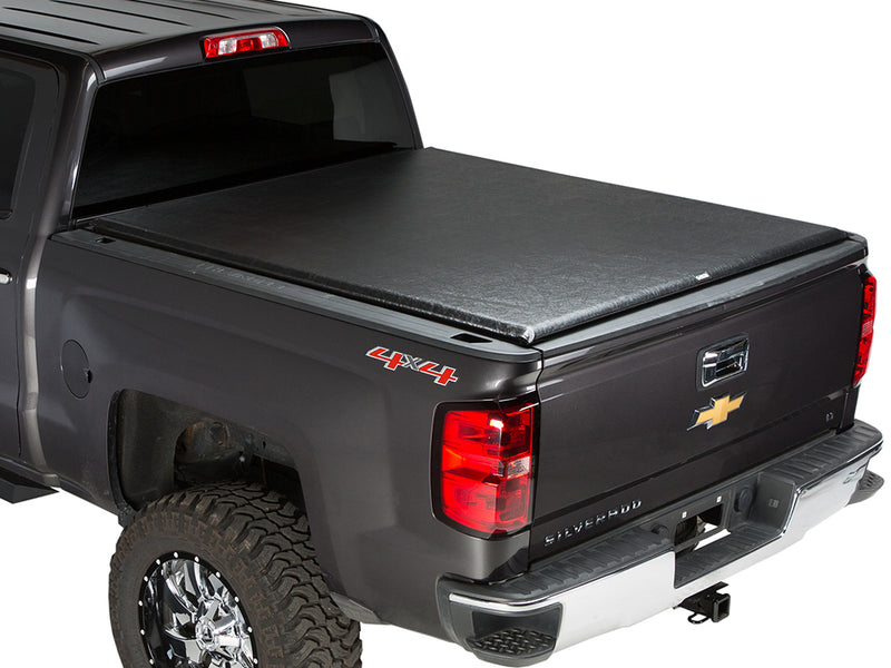 Gator SRX soft roll-up tonneau cover: Dark gray 4x4 pickup with a black soft roll-up tonneau cover closed over the bed, rear three-quarter view