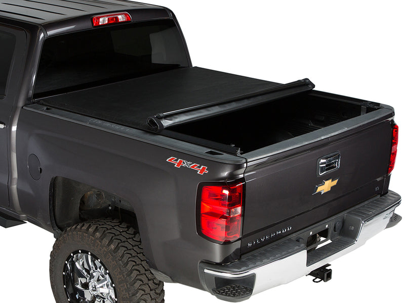 Gator SRX soft roll-up tonneau cover: Dark gray Chevrolet Silverado 4x4 with a soft roll-up tonneau cover partly rolled toward the cab