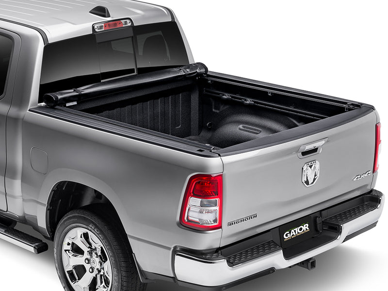 Gator SRX soft roll-up tonneau cover: Silver Ram 1500 with a soft roll-up tonneau cover rolled up at the cab and the bed open