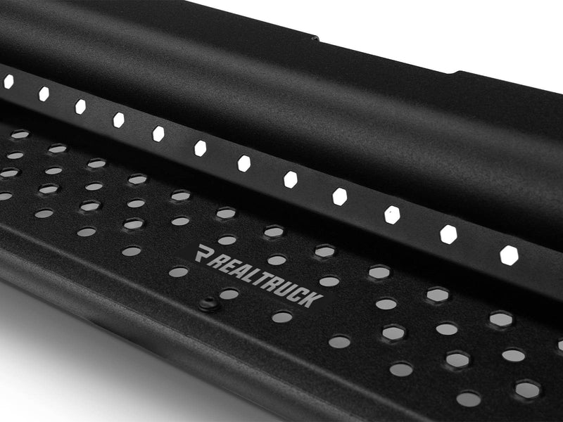 Go Rhino Dominator D1: close-up of a black perforated step tread with RealTruck plate