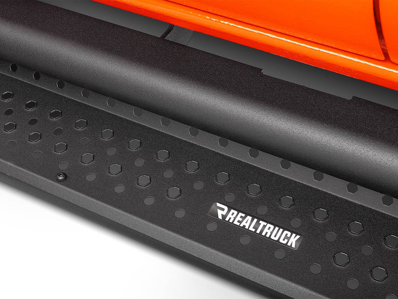 Go Rhino Dominator D1: close-up of a textured black side step tread with hex pattern under an orange body