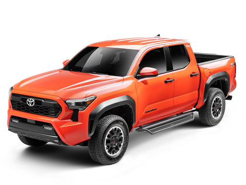 Go Rhino Dominator D1: orange Toyota Tacoma double cab with black side steps along the cab, front three-quarter view