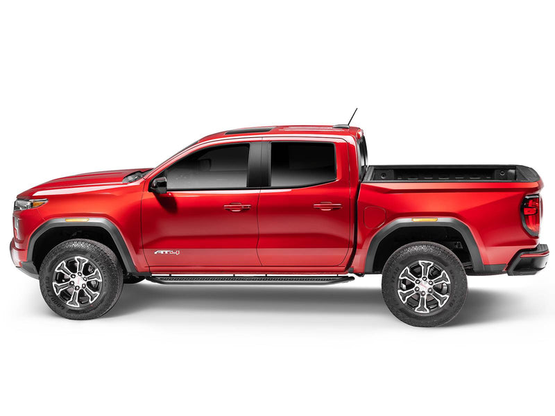 Go Rhino Dominator D6: red GMC Canyon AT4 crew cab in side profile with black side steps along the cab