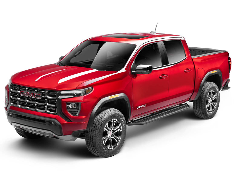 Go Rhino Dominator D6: red GMC Canyon AT4 crew cab with black side steps, front three-quarter view