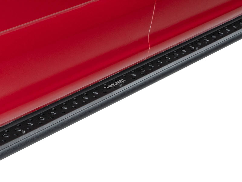 Go Rhino Dominator DSS: close-up of a black perforated slider board mounted below a red door