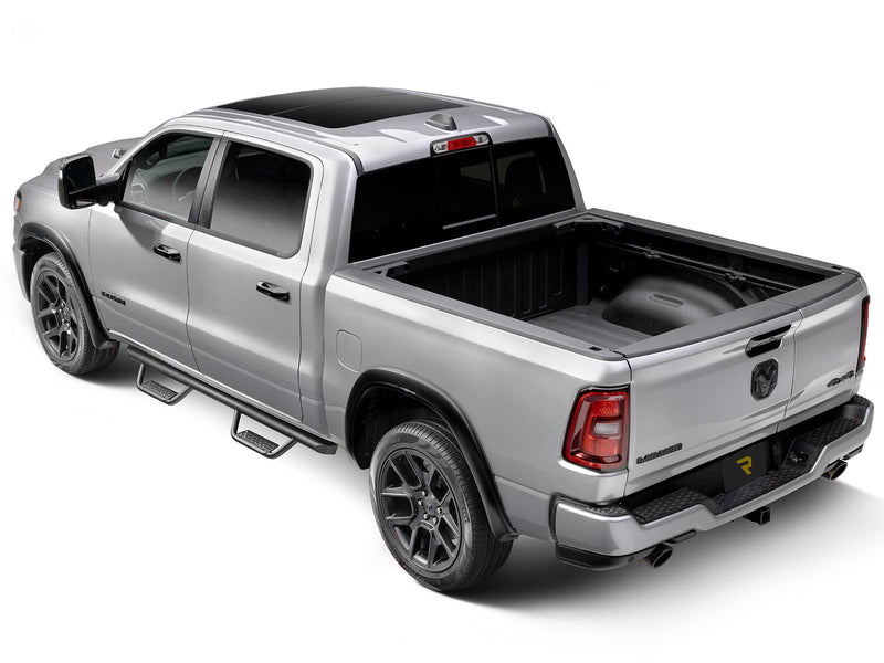 Go Rhino Dominator Xtreme D2: silver crew cab pickup from the rear three quarter with black tube side steps under the doors