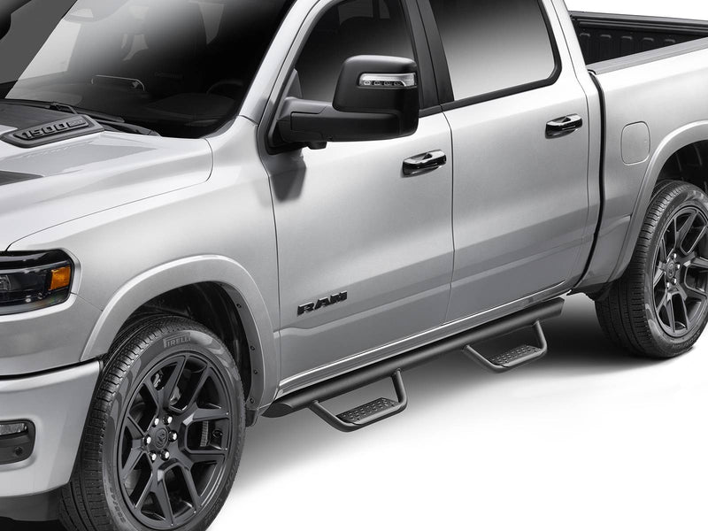 Go Rhino Dominator Xtreme D2: silver crew cab pickup with a black tube side step and drop steps at each door, front three quarter close view
