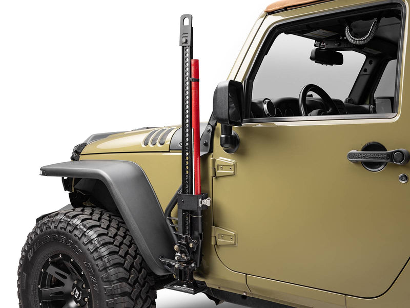 Go Rhino Exterior Jack Mount: black jack mount holding a red farm jack beside the front door of an olive Jeep Wrangler (shown with Hi-Lift style farm jack, not included)