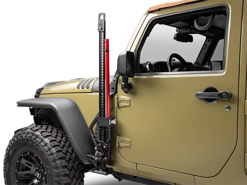 Go Rhino Exterior Jack Mount: black jack mount holding a red farm jack beside the front door of an olive Jeep Wrangler (shown with Hi-Lift style farm jack, not included)