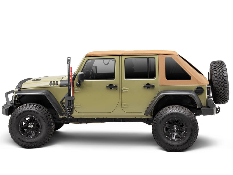 Go Rhino Exterior Jack Mount: side view of an olive four door Jeep Wrangler with tan soft top and a red farm jack held at the front door (shown with Hi-Lift style farm jack, aftermarket bumpers, aftermarket wheels and tires, not included)