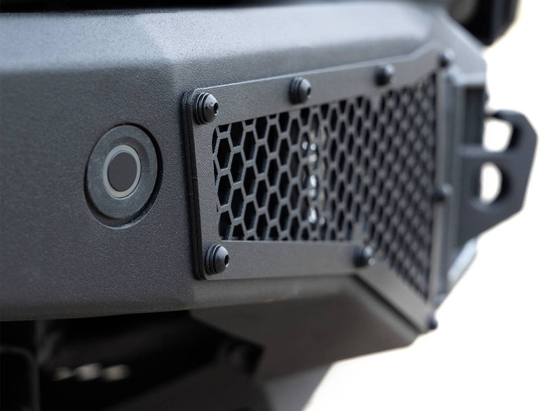 Go Rhino Rockline: close-up of a textured black bumper wing with hex mesh panel, sensor port and shackle mount