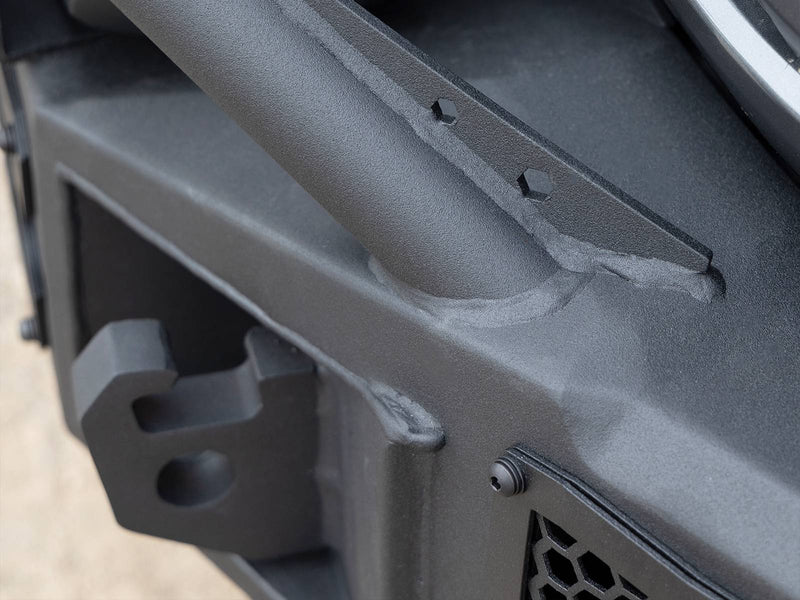 Go Rhino Rockline: close-up of a textured black bumper shackle mount and overrider tube weld