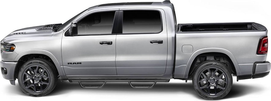 Go Rhino Dominator Xtreme D2 Side Steps: Silver crew cab pickup in side profile with black tube side steps and a drop step at each door