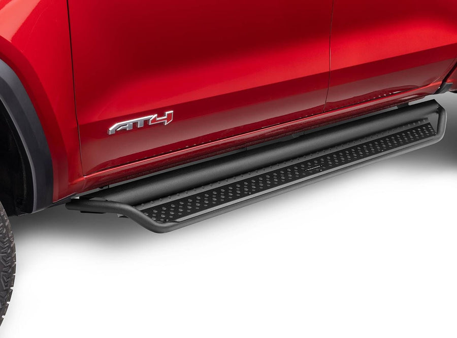 Go Rhino Dominator D1 Side Steps: Black side step under the doors of a red GMC Canyon AT4, low side view