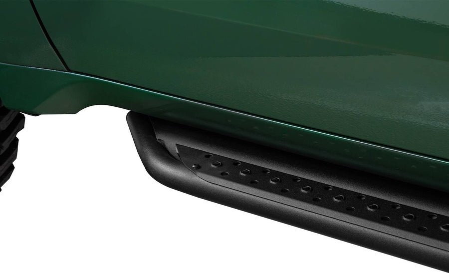 Go Rhino Dominator DSS Sliders: Black slider board mounted below the door of a dark green truck