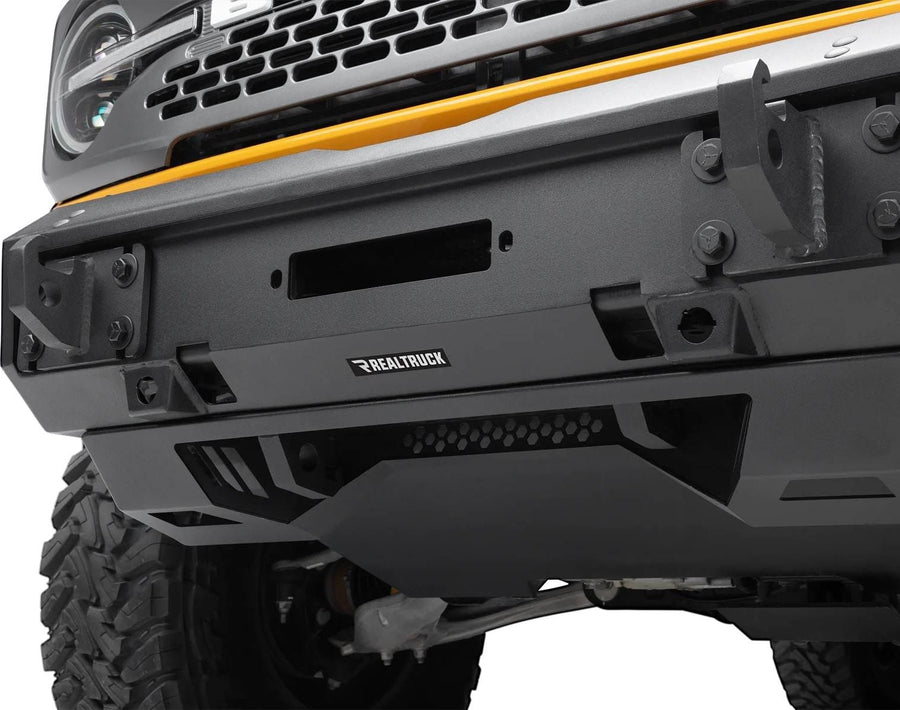 Go Rhino Trailline Full Width Front Bumper: Close view of a full-width front bumper winch plate area and skid plate installed on a Ford Bronco