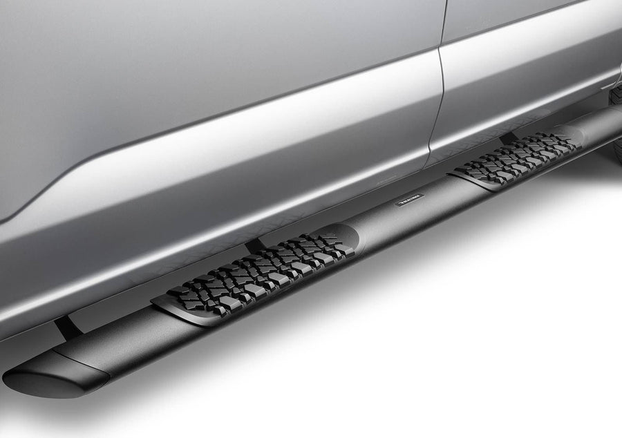 Go Rhino V-Series V3 Side Steps: Black side step with a tread pad under the rear door of a silver pickup
