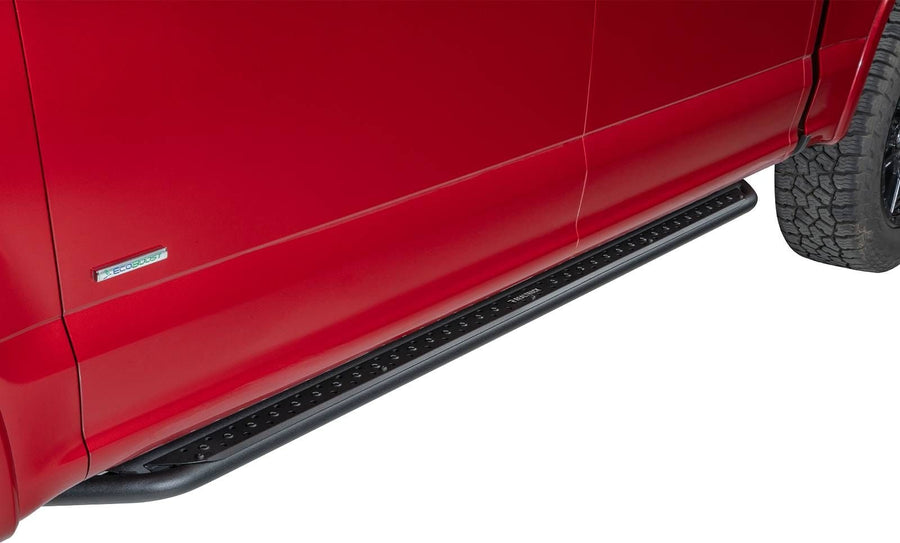 Go Rhino Dominator DSS Sliders: Black slider board mounted under the doors of a red pickup with an EcoBoost fender badge