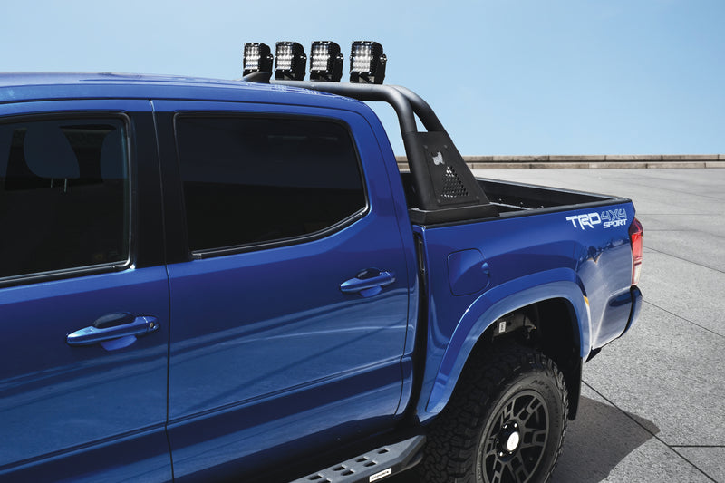 Go Rhino Sport Bar 3.0: blue mid-size double cab pickup with a black sport bar and four cube lights over the bed (shown with four cube lights, running boards, not included)