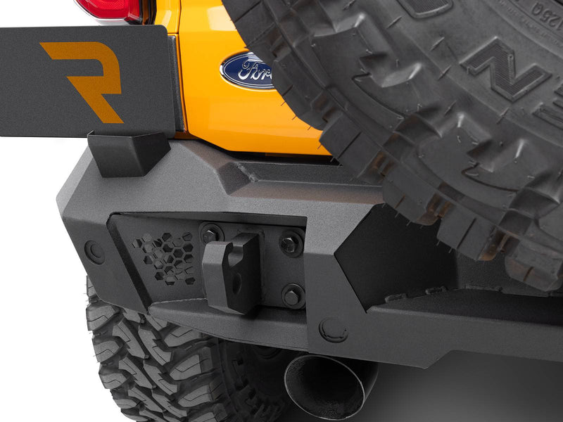 Go Rhino Trailline: rear bumper corner with recovery point beside the Ford oval on an orange Bronco tailgate (shown with spare tire, not included)