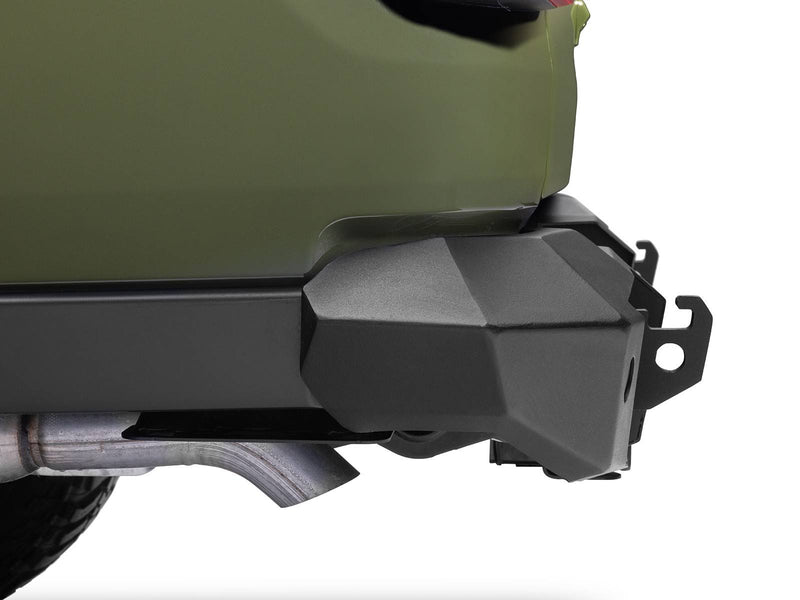 Go Rhino Trailline: rear bumper end with tire carrier tab installed below a green body panel